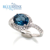 14 Karat White Gold Ring with One 1.43 Carat Oval London Blue Topaz an